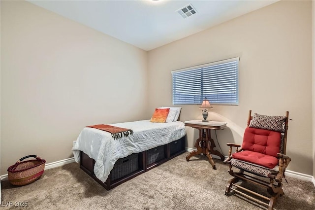 carpeted bedroom featuring visible vents and baseboards