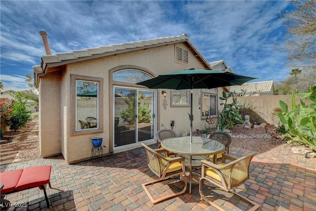 view of patio / terrace featuring fence and outdoor dining area