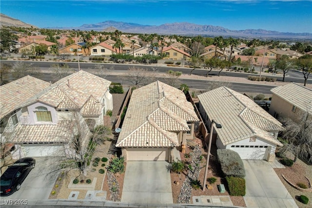 birds eye view of property with a residential view and a mountain view