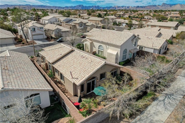 drone / aerial view with a mountain view and a residential view