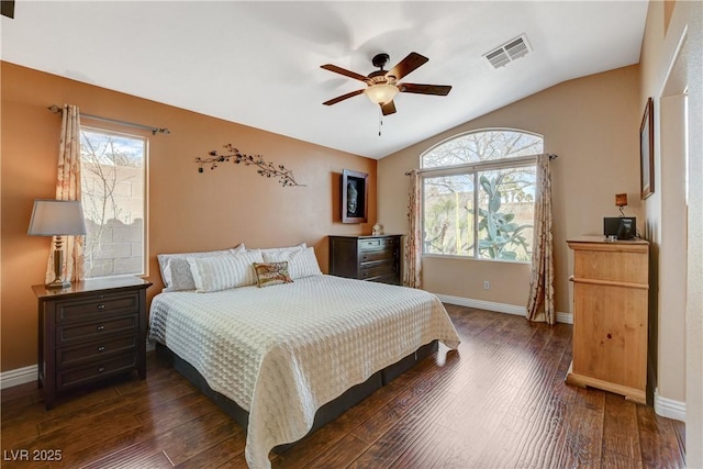 bedroom featuring multiple windows, visible vents, vaulted ceiling, and dark wood-style flooring