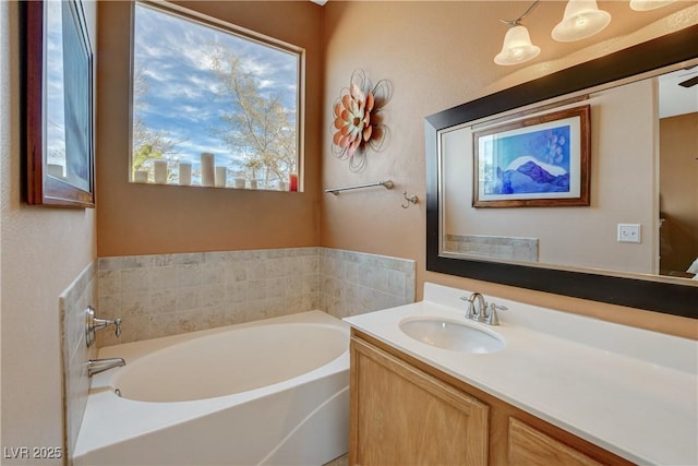 bathroom with a bath and vanity