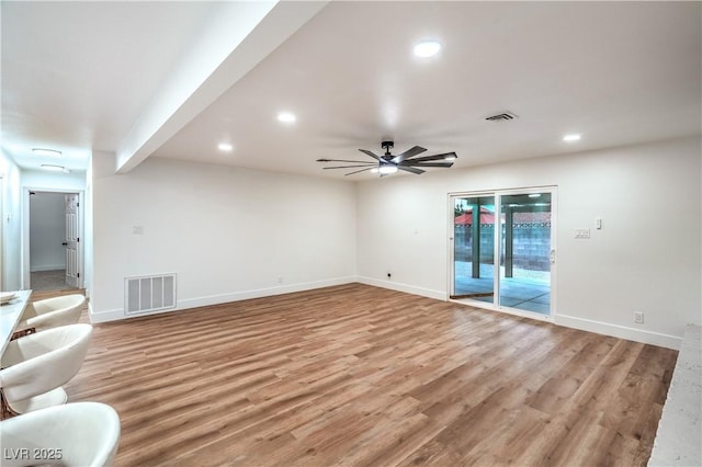 unfurnished living room with recessed lighting, visible vents, and light wood-style flooring