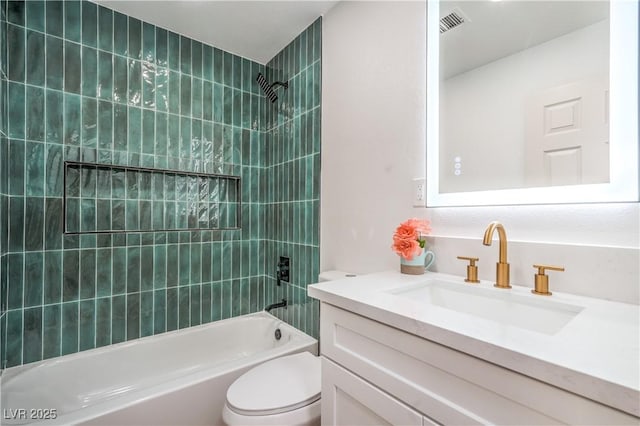 full bath featuring bathing tub / shower combination, toilet, and vanity