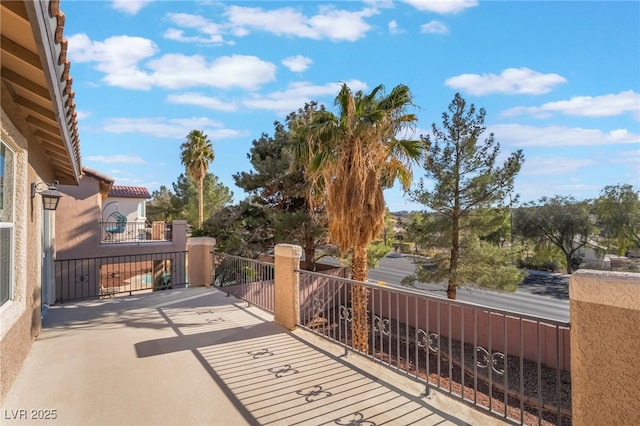 view of patio featuring a balcony