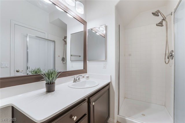 bathroom featuring a stall shower and vanity