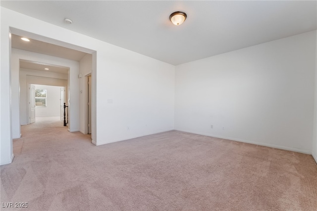 empty room with light colored carpet