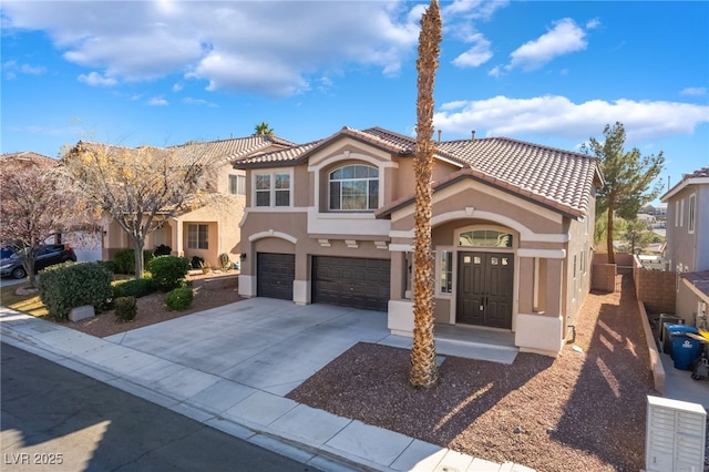 mediterranean / spanish-style house featuring a garage, driveway, a tile roof, fence, and stucco siding