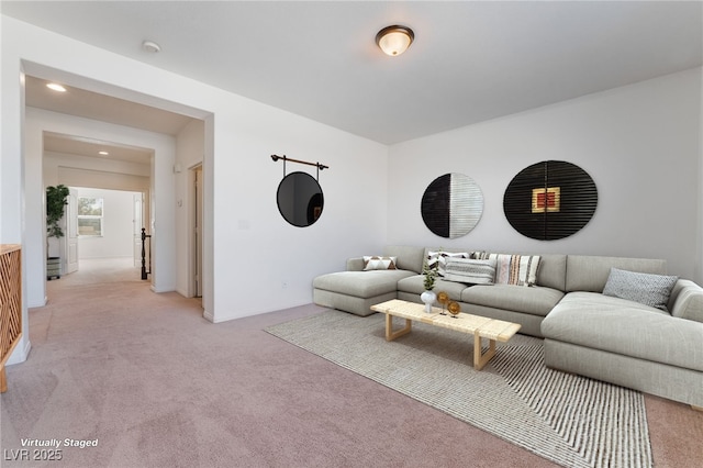 living area with light colored carpet