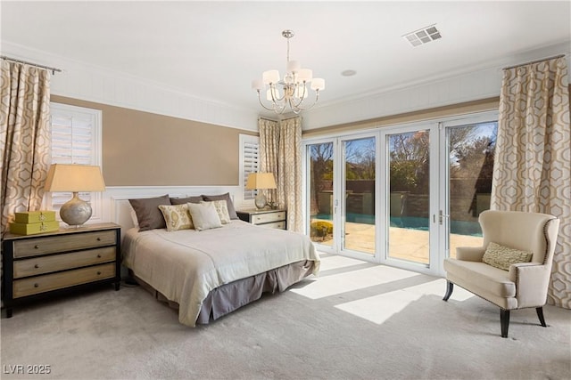 bedroom with a notable chandelier, visible vents, ornamental molding, light carpet, and access to outside