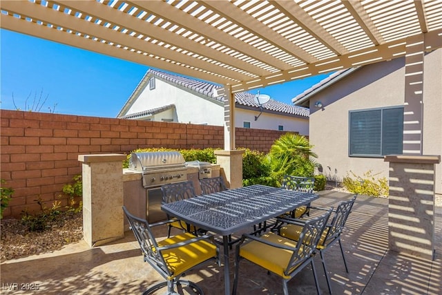 view of patio with a grill, fence, a pergola, and outdoor dining space