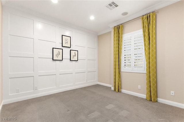 empty room featuring baseboards, crown molding, visible vents, and carpet flooring