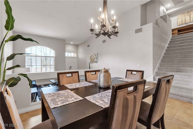 dining area with stairs, baseboards, visible vents, and an inviting chandelier