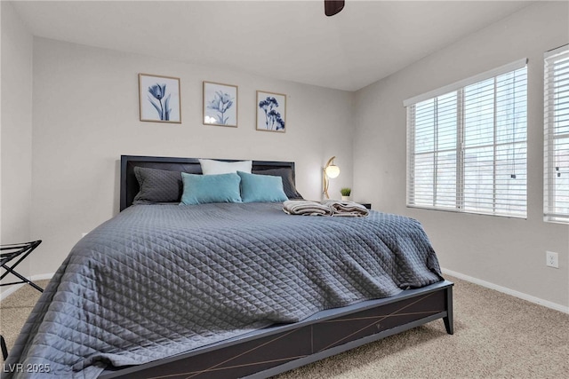 carpeted bedroom featuring baseboards