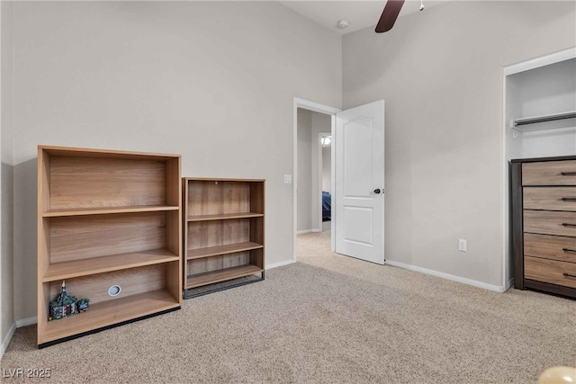 unfurnished bedroom featuring carpet floors, ceiling fan, and baseboards