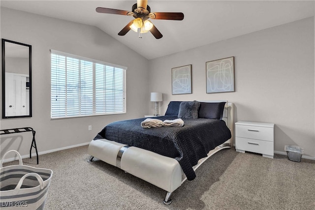 bedroom with vaulted ceiling, carpet flooring, and baseboards