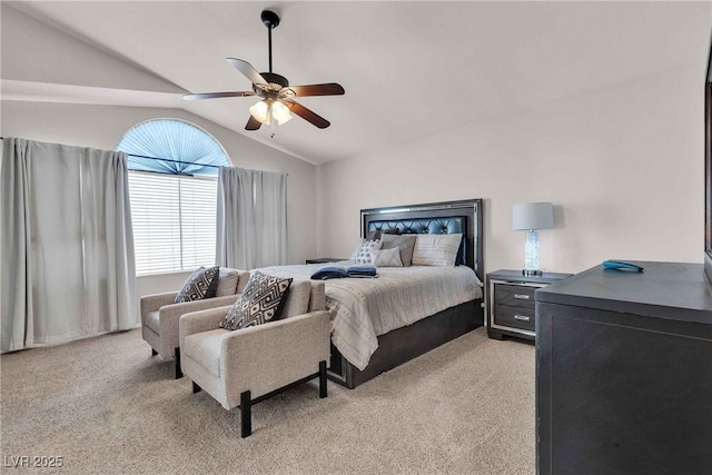 bedroom with lofted ceiling, light colored carpet, and ceiling fan