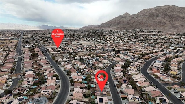 drone / aerial view with a residential view and a mountain view