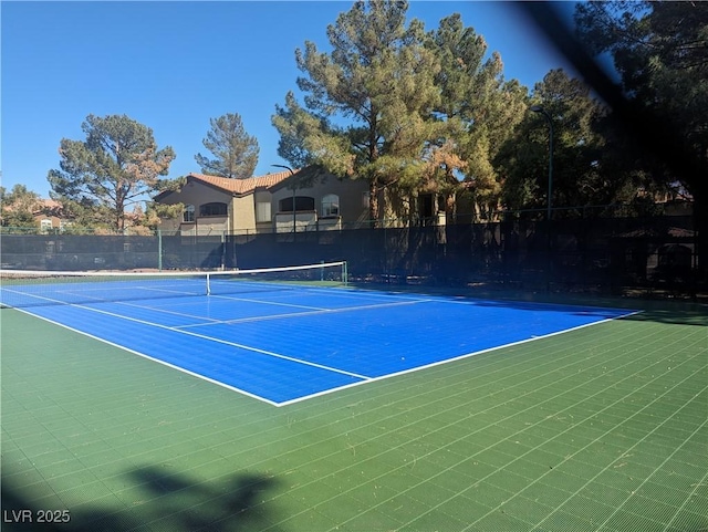 view of sport court with fence