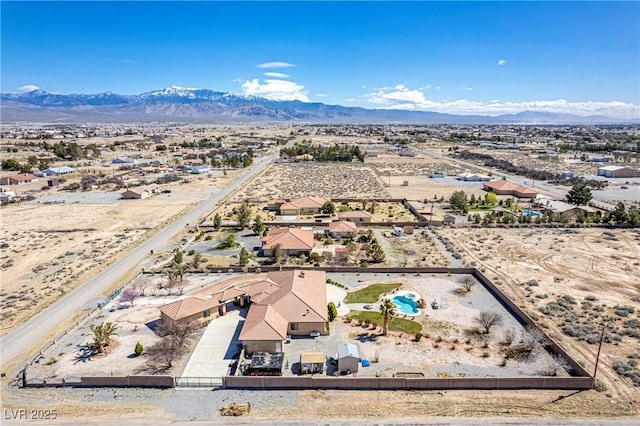 aerial view featuring a mountain view and a desert view