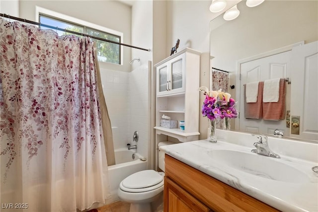 bathroom featuring toilet, shower / bath combination with curtain, and vanity