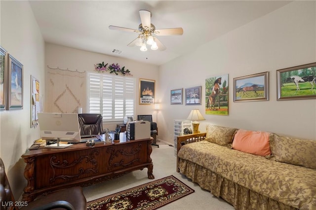 carpeted office space featuring a ceiling fan and visible vents