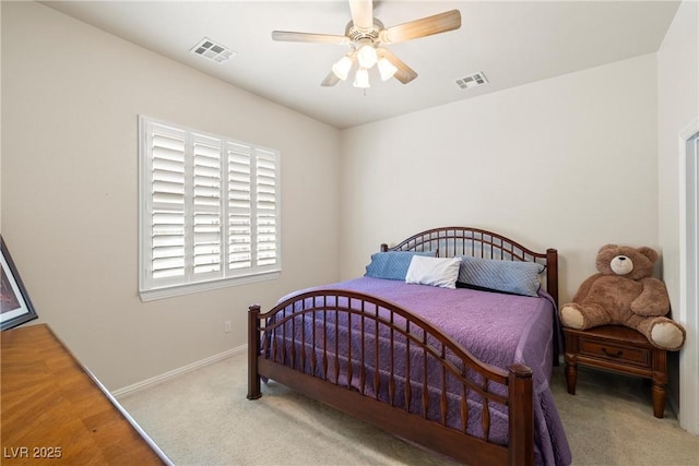 carpeted bedroom with ceiling fan, visible vents, and baseboards