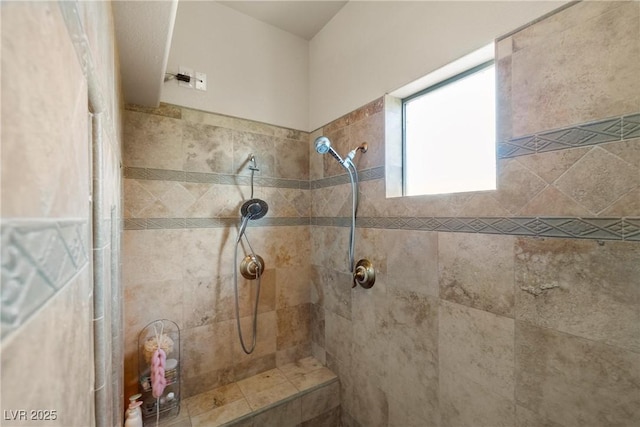 full bath featuring a tile shower