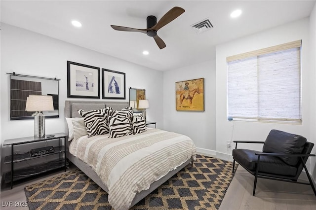 bedroom with recessed lighting, dark wood-type flooring, a ceiling fan, baseboards, and visible vents