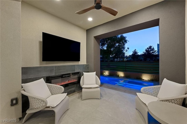 view of patio / terrace with an outdoor pool, fence, outdoor lounge area, and a ceiling fan