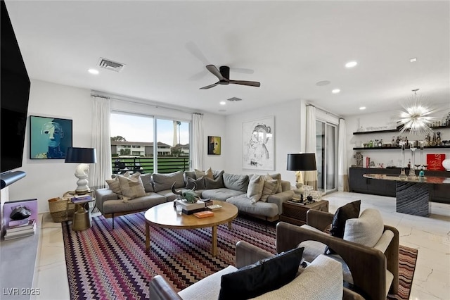 living area featuring ceiling fan, a dry bar, visible vents, and recessed lighting