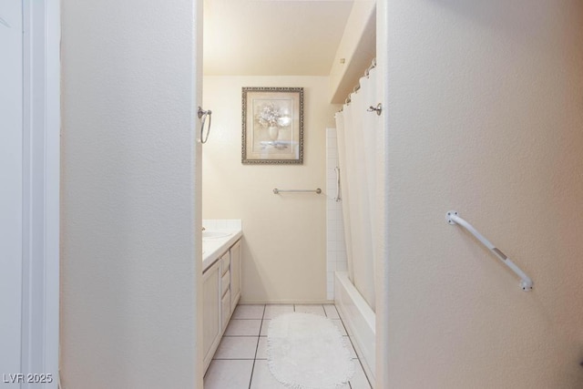 bathroom featuring tile patterned flooring and vanity