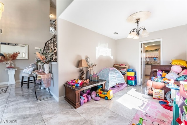 rec room featuring a chandelier, visible vents, and baseboards