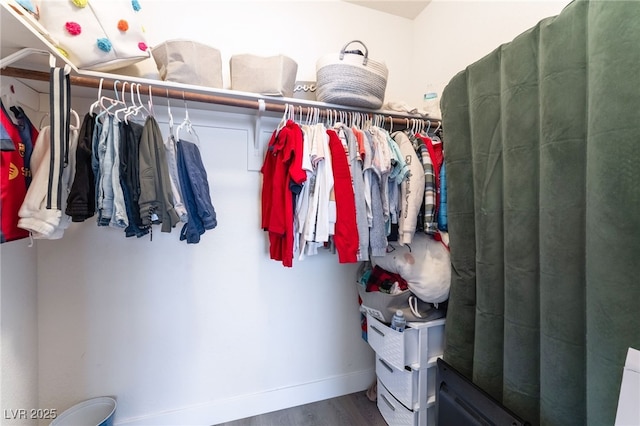 spacious closet featuring wood finished floors