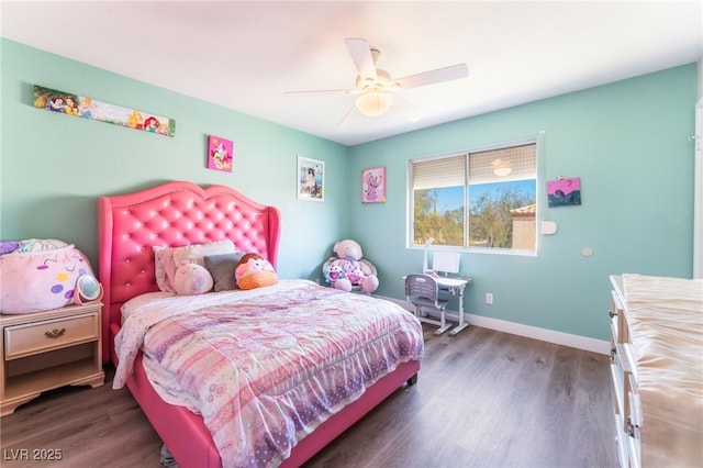 bedroom featuring ceiling fan, baseboards, and wood finished floors