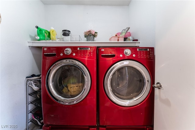 clothes washing area featuring washing machine and dryer and laundry area