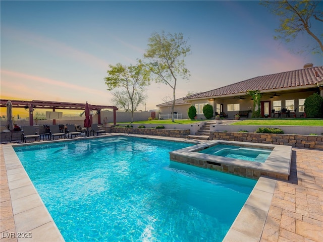 outdoor pool with a patio, fence, a ceiling fan, an in ground hot tub, and a pergola