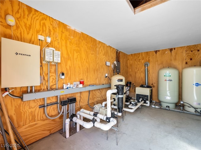 workout area featuring wooden walls