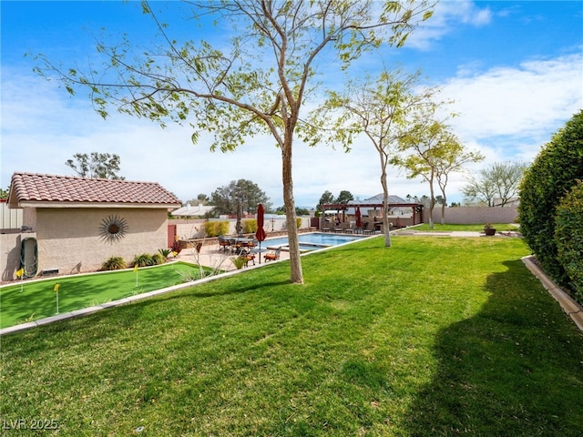 view of yard with a fenced in pool, a fenced backyard, a gazebo, an outdoor structure, and a patio area