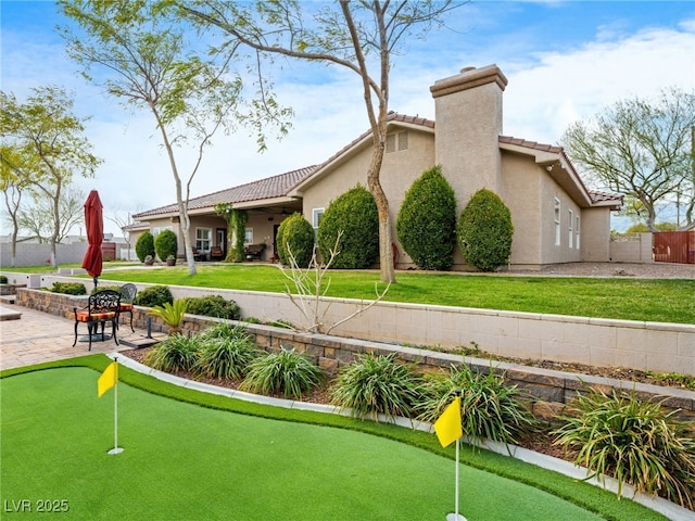 view of community with a patio and fence