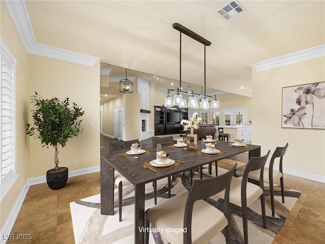 dining space featuring visible vents, baseboards, and ornamental molding