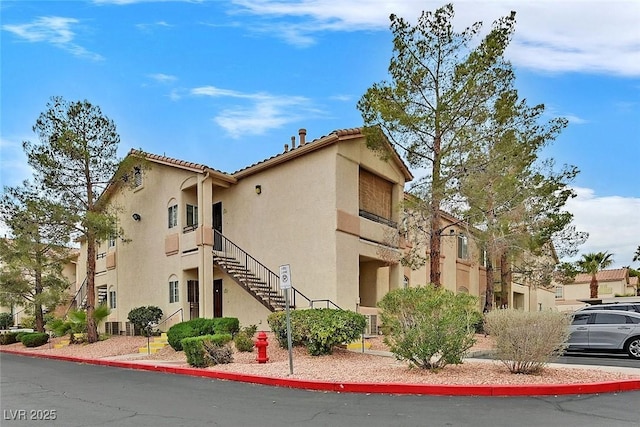 view of property featuring stairway