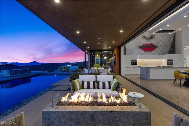 11 Cloud Chaser Blvd, Henderson, NV 89012 - exterior space with an outdoor fire pit, a patio, and an outdoor kitchen