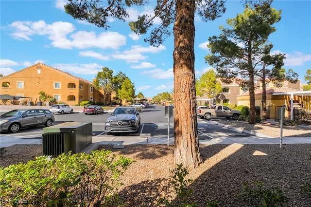 uncovered parking lot with a residential view