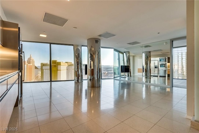 common area featuring visible vents and a city view