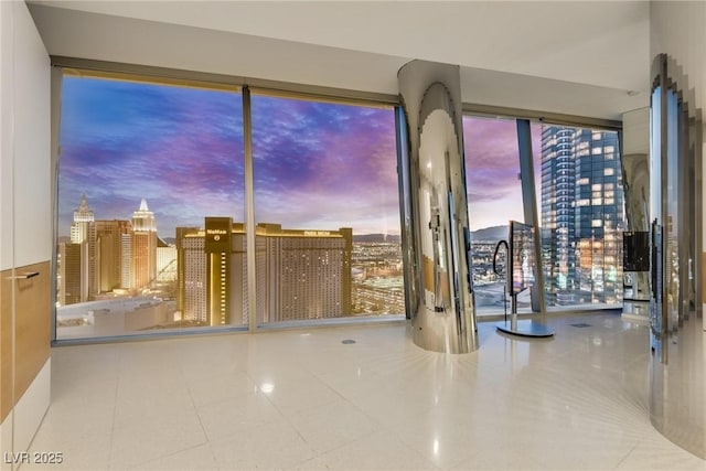 interior space featuring tile patterned floors and a city view