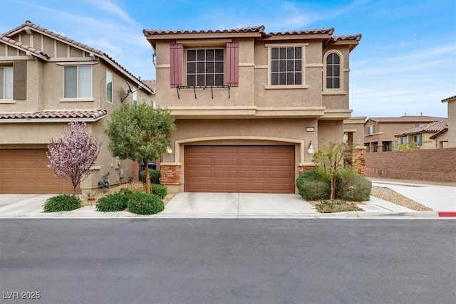 view of front of house with a garage, concrete driveway, a tiled roof, and stucco siding