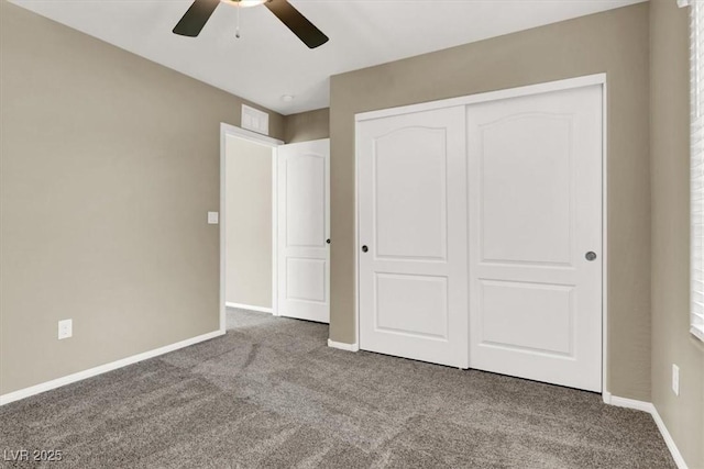 unfurnished bedroom with carpet, visible vents, and baseboards