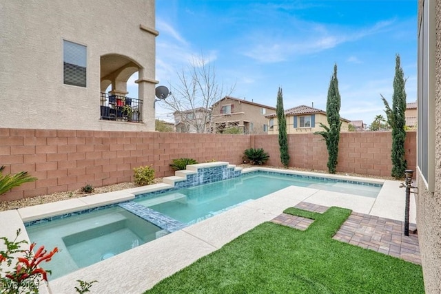 view of swimming pool with a patio area, a fenced backyard, and a pool with connected hot tub