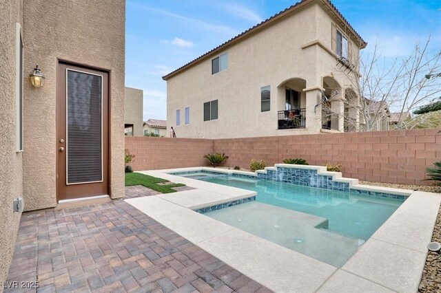 view of pool with a patio area, a fenced backyard, and a fenced in pool